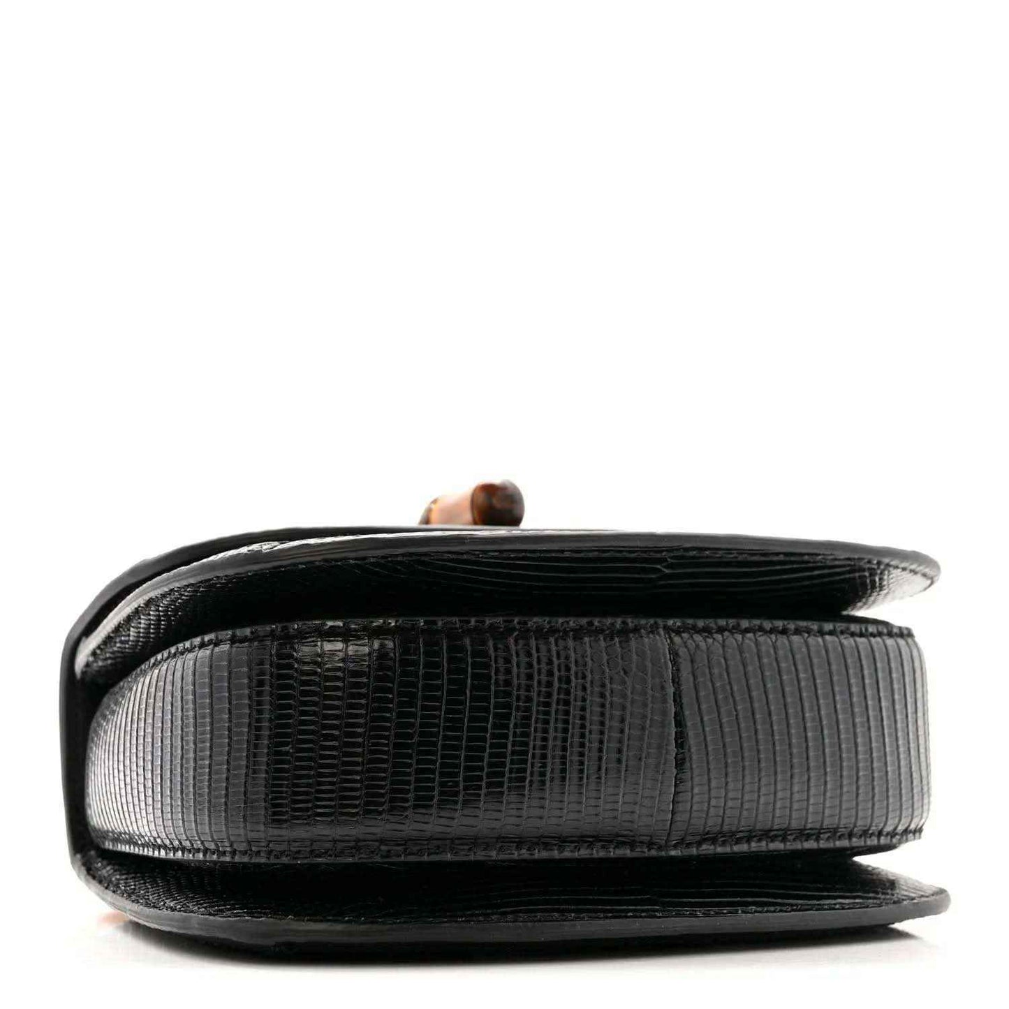 Side view of black mini top handle bag with textured finish and bamboo handle detail