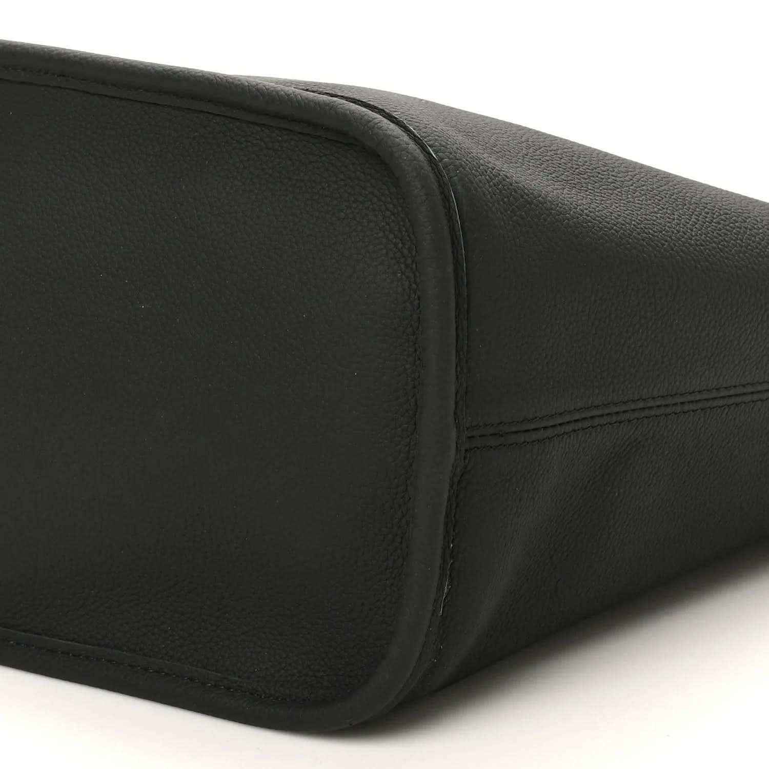Black pebbled leather tote bottom corner with seam and curved profile