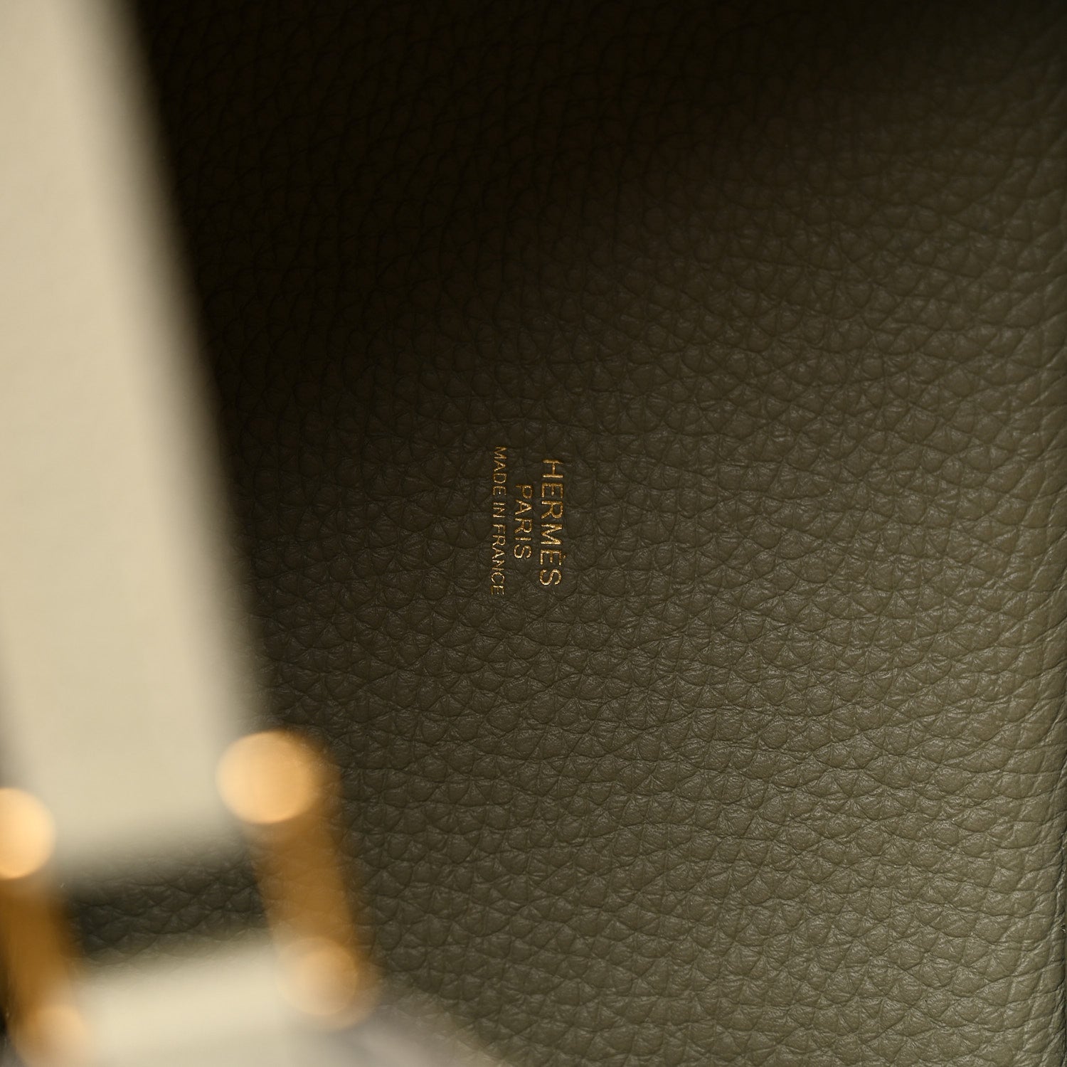 Sauge leather tote bag interior stamp label in tan-gold text