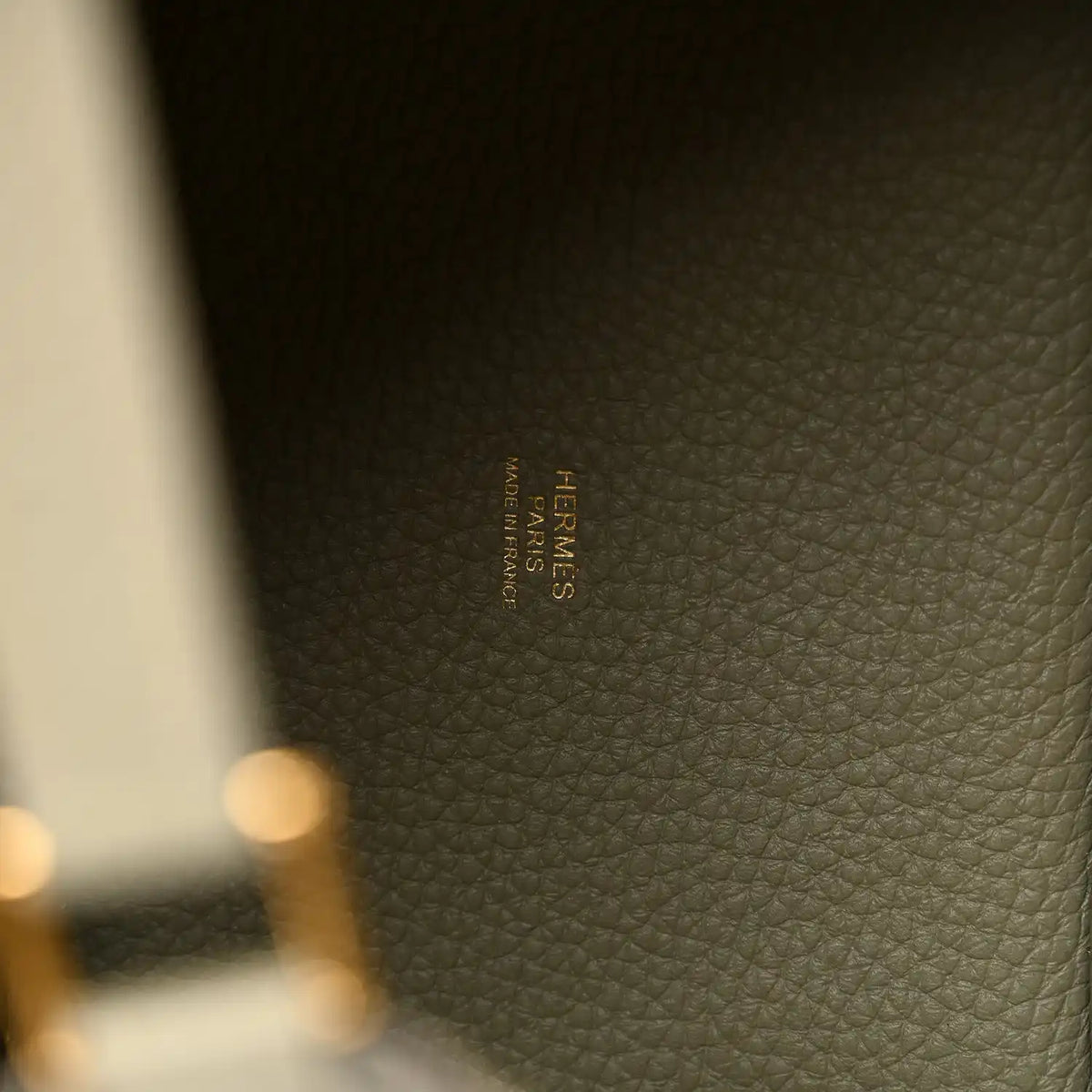 Sauge leather tote bag interior stamp label in tan-gold text