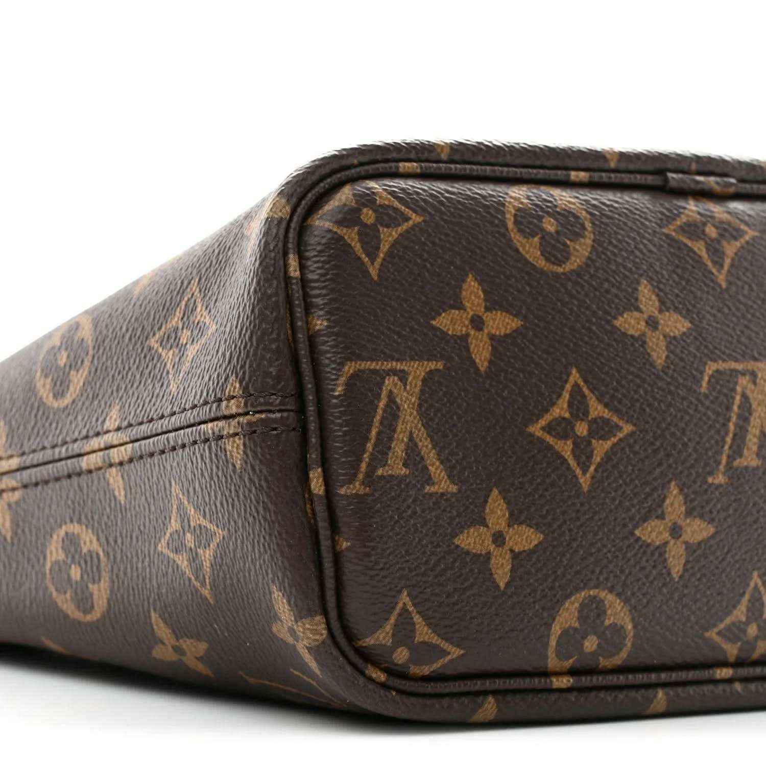 Dark monogram mini bag with curved top edge and matching monogram pattern on sides