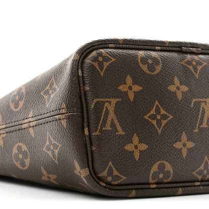 Dark monogram mini bag with curved top edge and matching monogram pattern on sides
