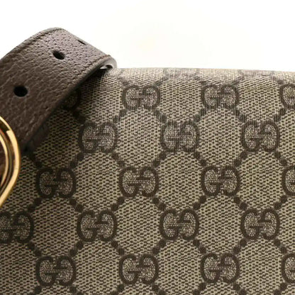 Medium top-handle bag GG monogram canvas panel with brown leather strap and gold ring