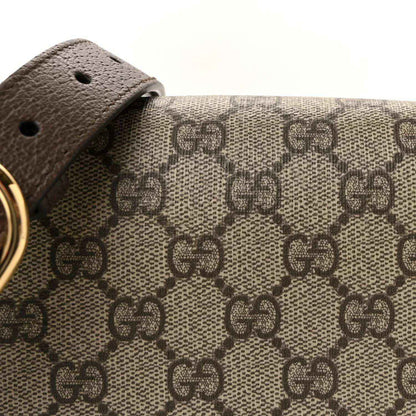 Medium top-handle bag GG monogram canvas panel with brown leather strap and gold ring