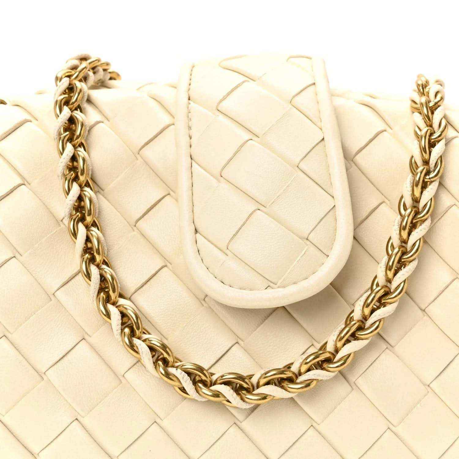 White intrecciato leather clutch with braided gold-tone chain and curved top flap