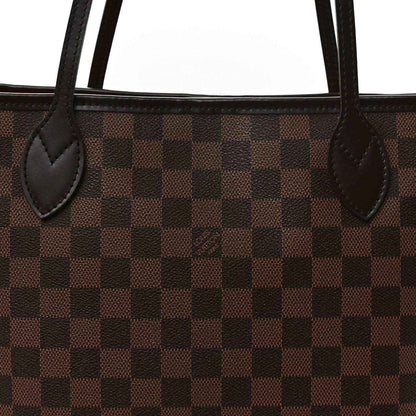 Damier Ebene tote bag close-up of brown check canvas and leather handle