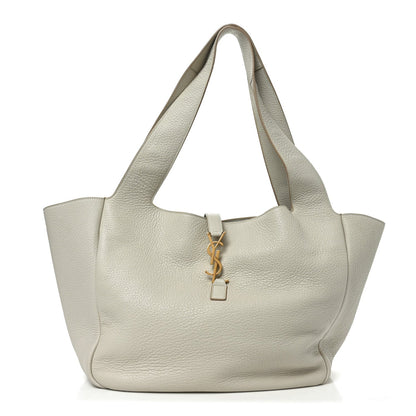 White grained leather tote bag with top handles and YSL charm key fob