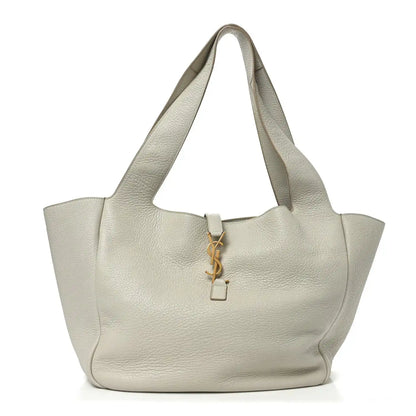 White grained leather tote bag with top handles and YSL charm key fob