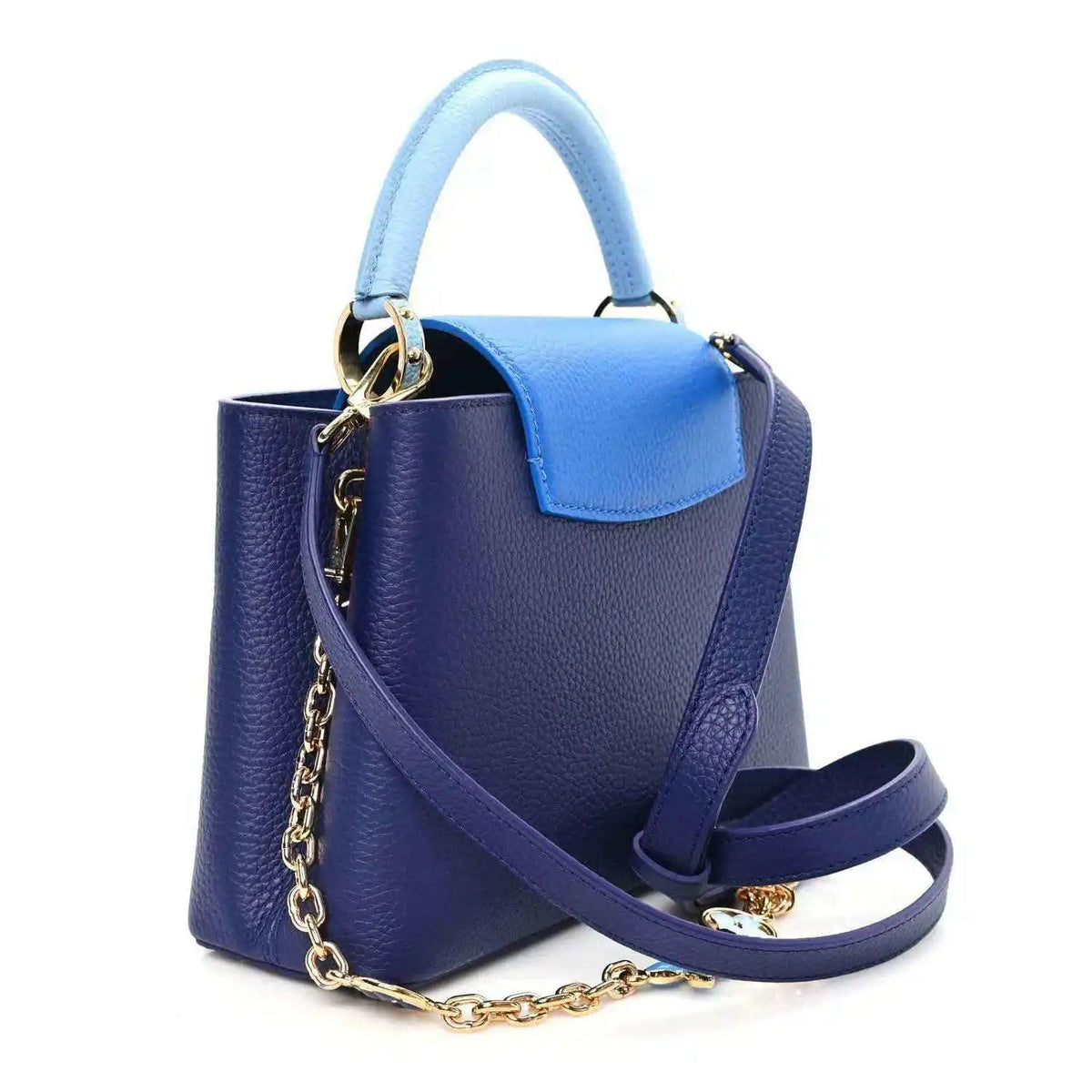 Blue pebbled leather handbag with light blue top handle and leather shoulder strap