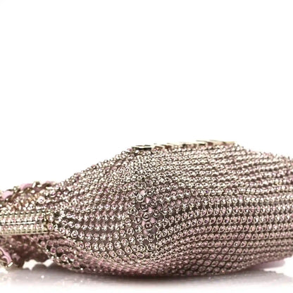 Chanel Mini 22 handbag side profile with dense crystal mesh and short chain edge.