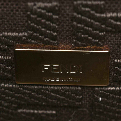 Fendi logo plate on dark brown fabric lining.