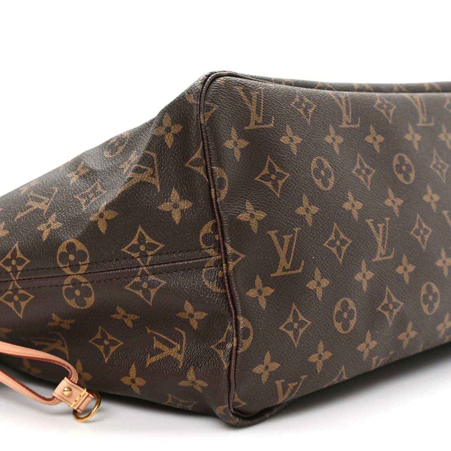 Monogram tote bag corner with brown patterned canvas and pink strap hardware