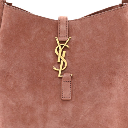 Small suede hobo bag front with YSL logo charm and top handle strap