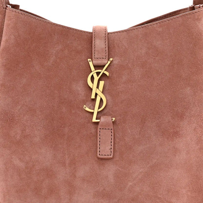 Small suede hobo bag front with YSL logo charm and top handle strap