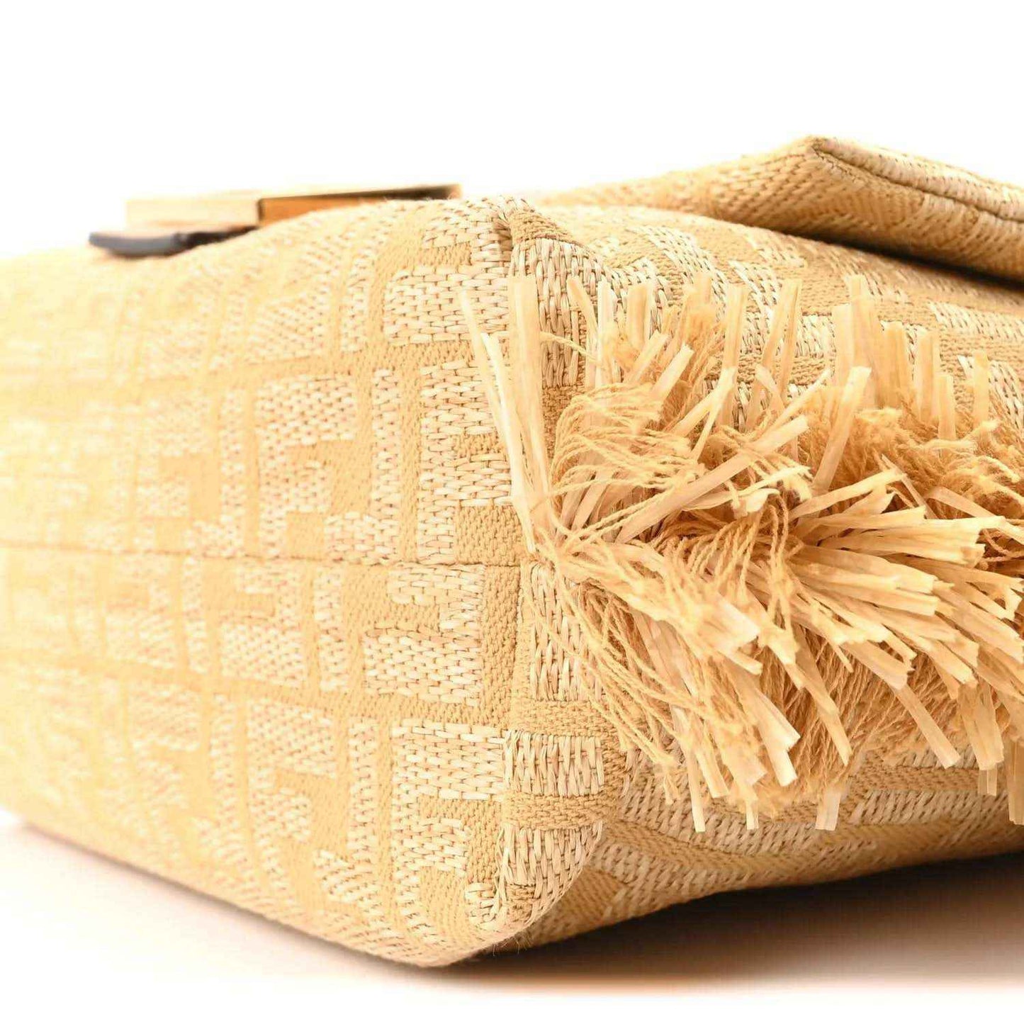 Fendi jacquard raffia fringe medium baguette bag, side corner with woven jacquard pattern and tassel