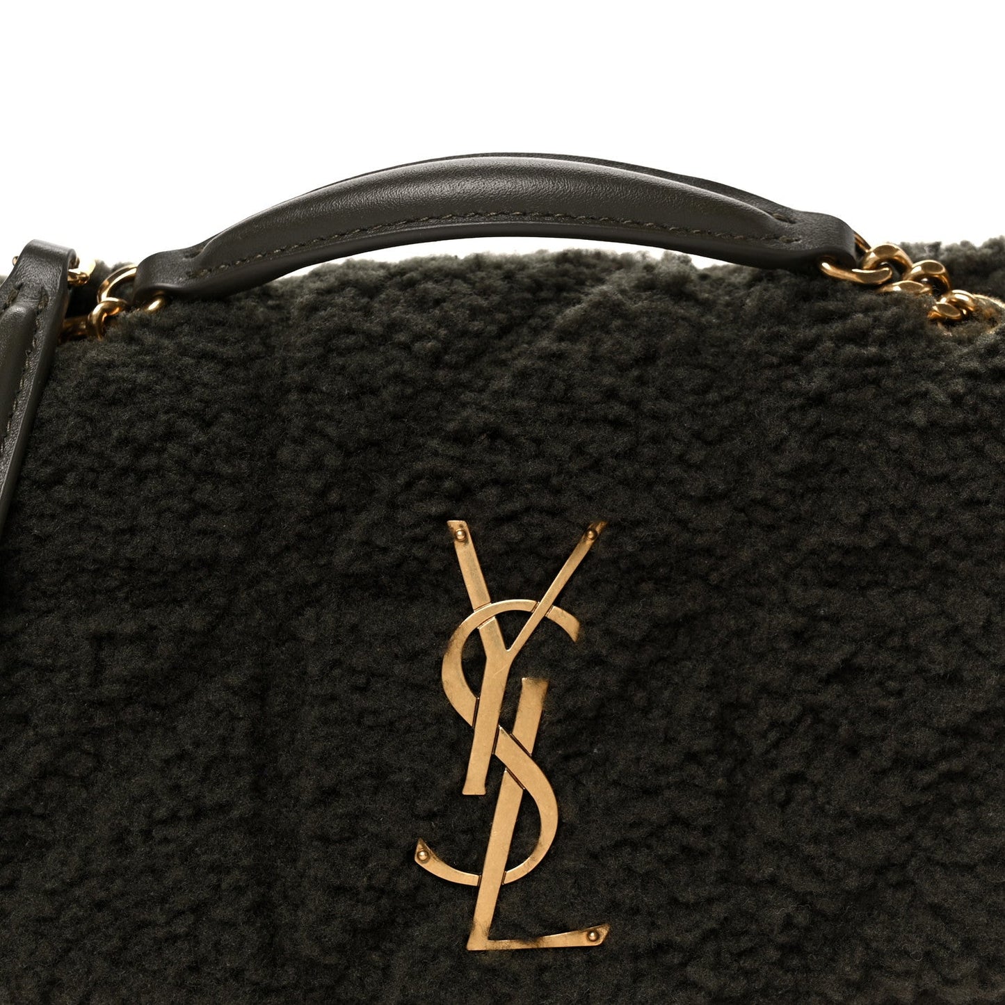 Saint Laurent shearling shoulder bag with gold YSL monogram emblem, close-up