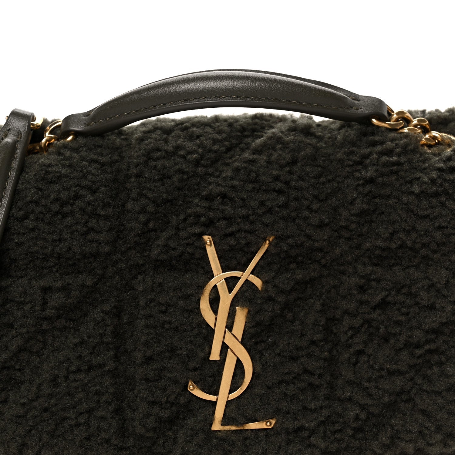 Saint Laurent shearling shoulder bag with gold YSL monogram emblem, close-up