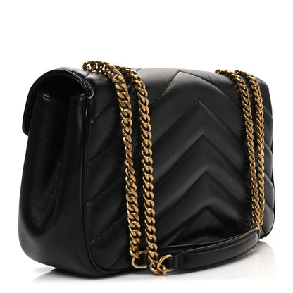 Black quilted lambskin shoulder bag with chevron pattern and gold chain strap