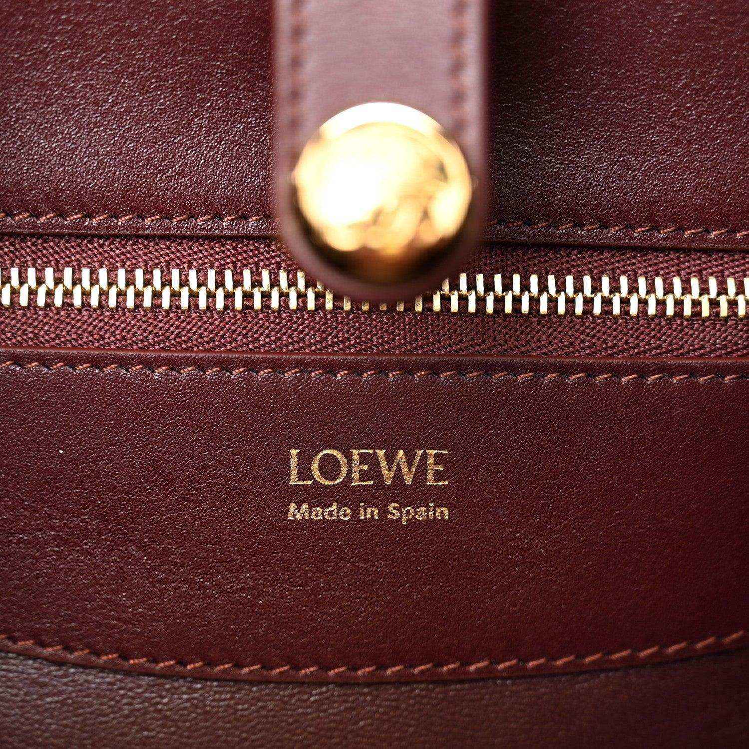 Loewe Small Madrid bag close-up: gold zipper pull and Loewe Made in Spain stamp
