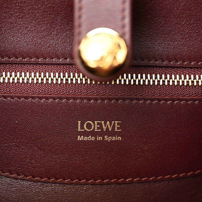Loewe Small Madrid bag close-up: gold zipper pull and Loewe Made in Spain stamp