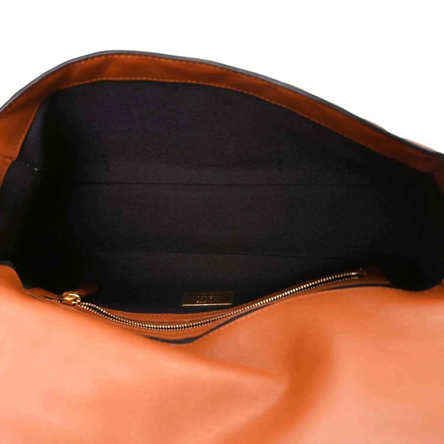 Fendi baguette bag interior view with zippered opening and black lining