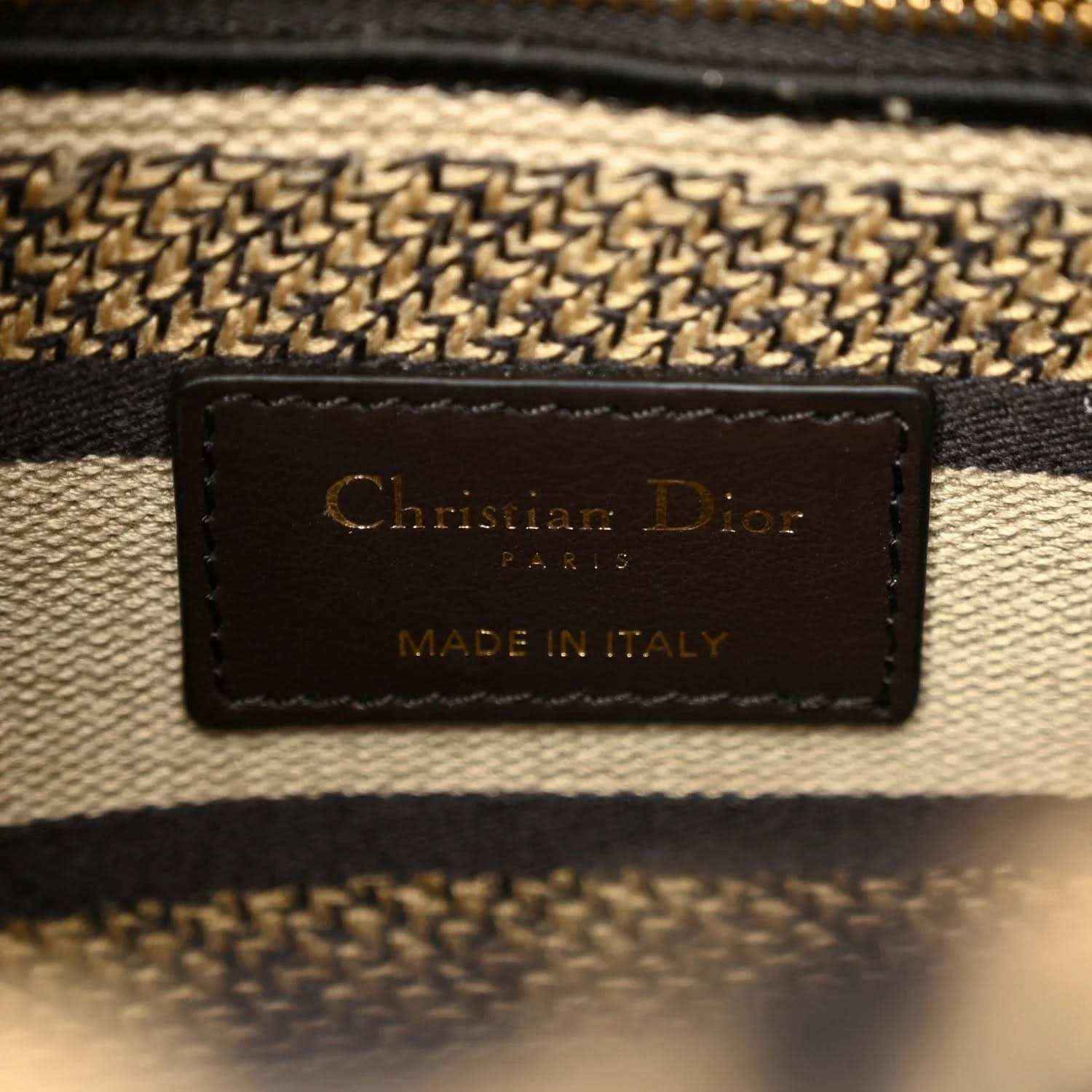 Christian Dior canvas bag label patch reading "Made in Italy"