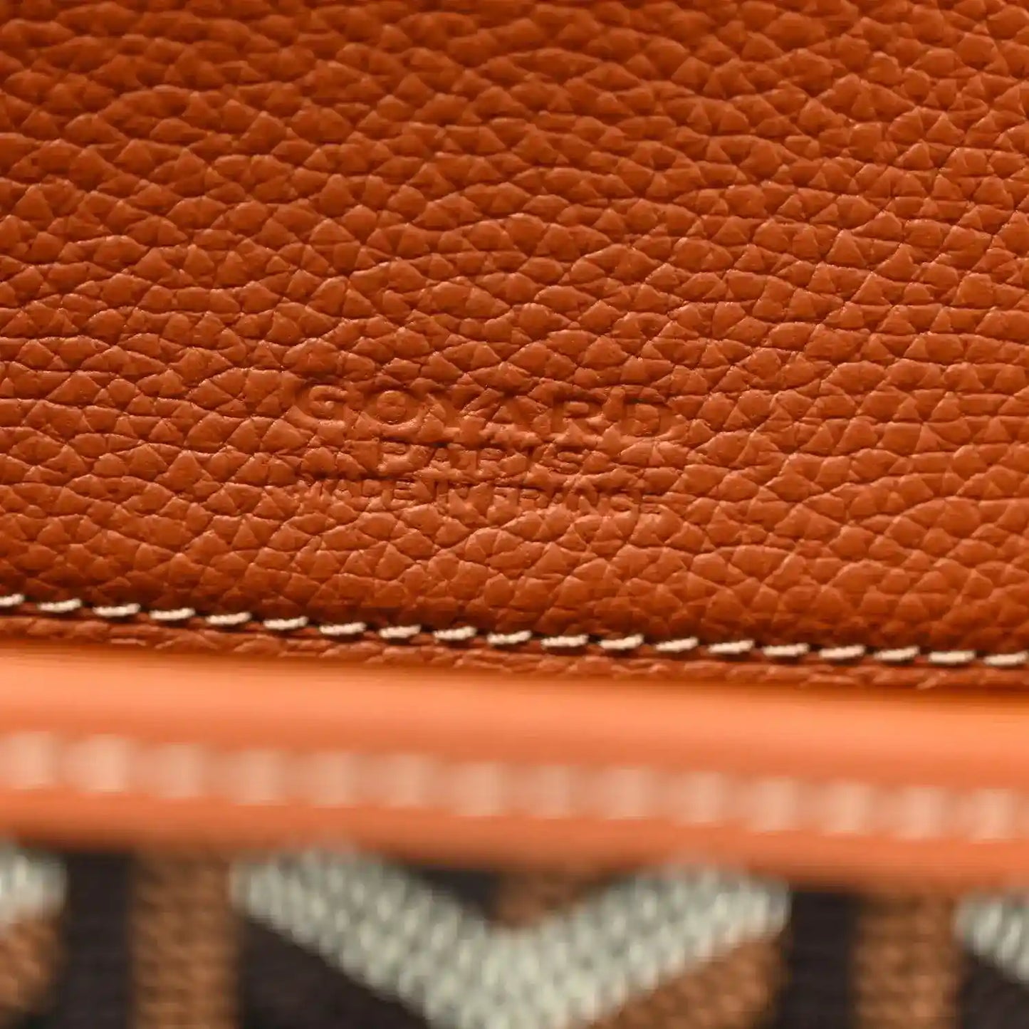 Belvedere II PM messenger bag close-up of brown leather texture with Goyard stamp