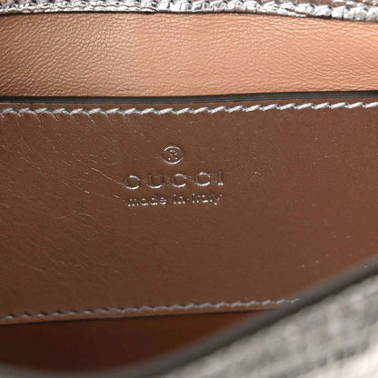 Gucci stamped leather interior panel with stitched edge