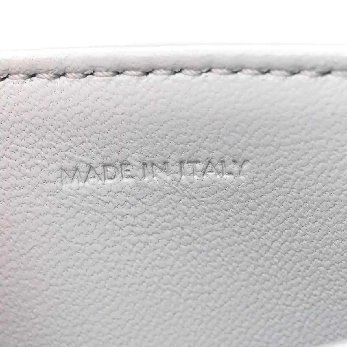 Shiny calfskin bag interior label reading MADE IN ITALY