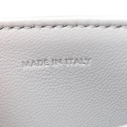 Shiny calfskin bag interior label reading MADE IN ITALY