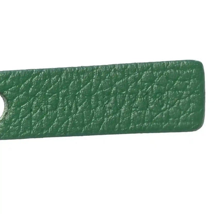 Green leather handle end detail with textured finish