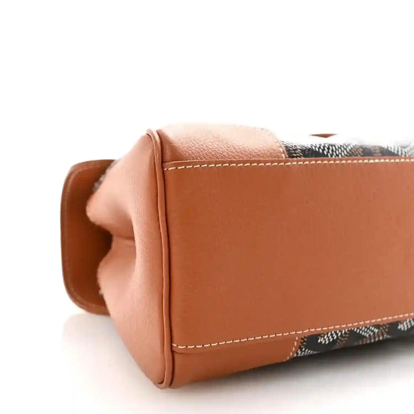 Mini Saigon shoulder bag side close-up, tan leather corner and contrast stitching