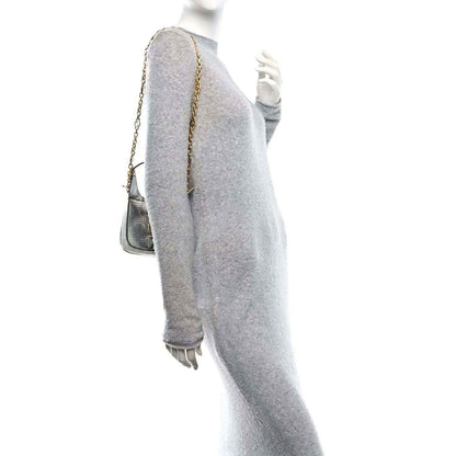 Silver lizard-effect mini shoulder bag with long gold-tone chain strap, side view