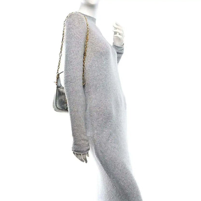 Silver lizard-effect mini shoulder bag with long gold-tone chain strap, side view