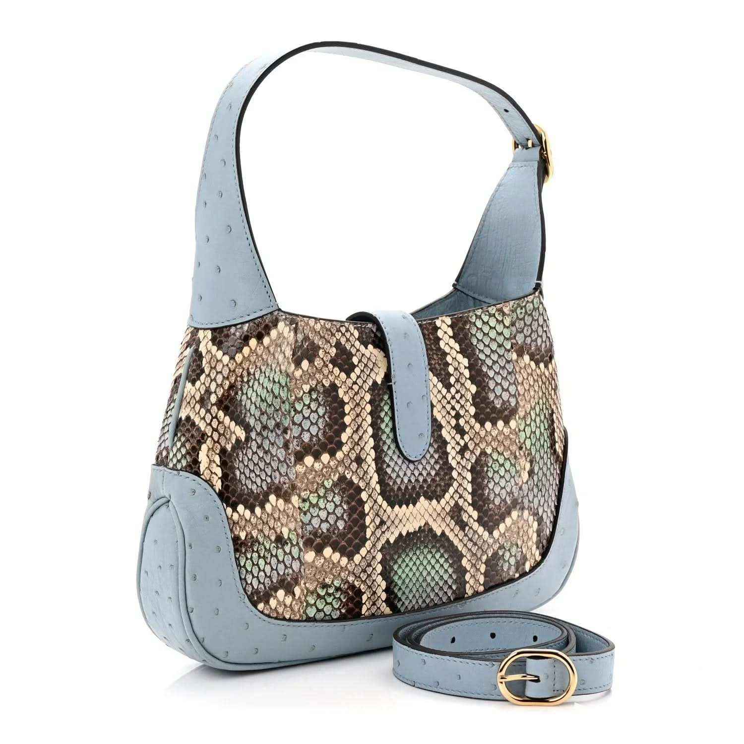 Small hobo bag with snakeskin front, light blue leather trim, and detachable strap
