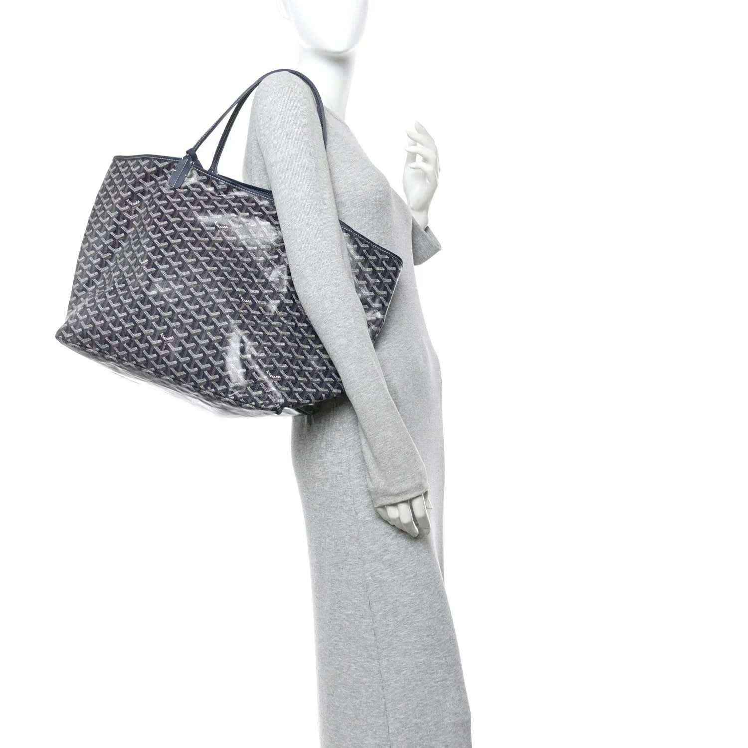 Navy patterned tote bag shown in side view with top handles and open silhouette.