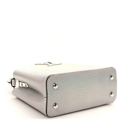 Iridescent lizard mini handbag side view with flap and silver hardware studs