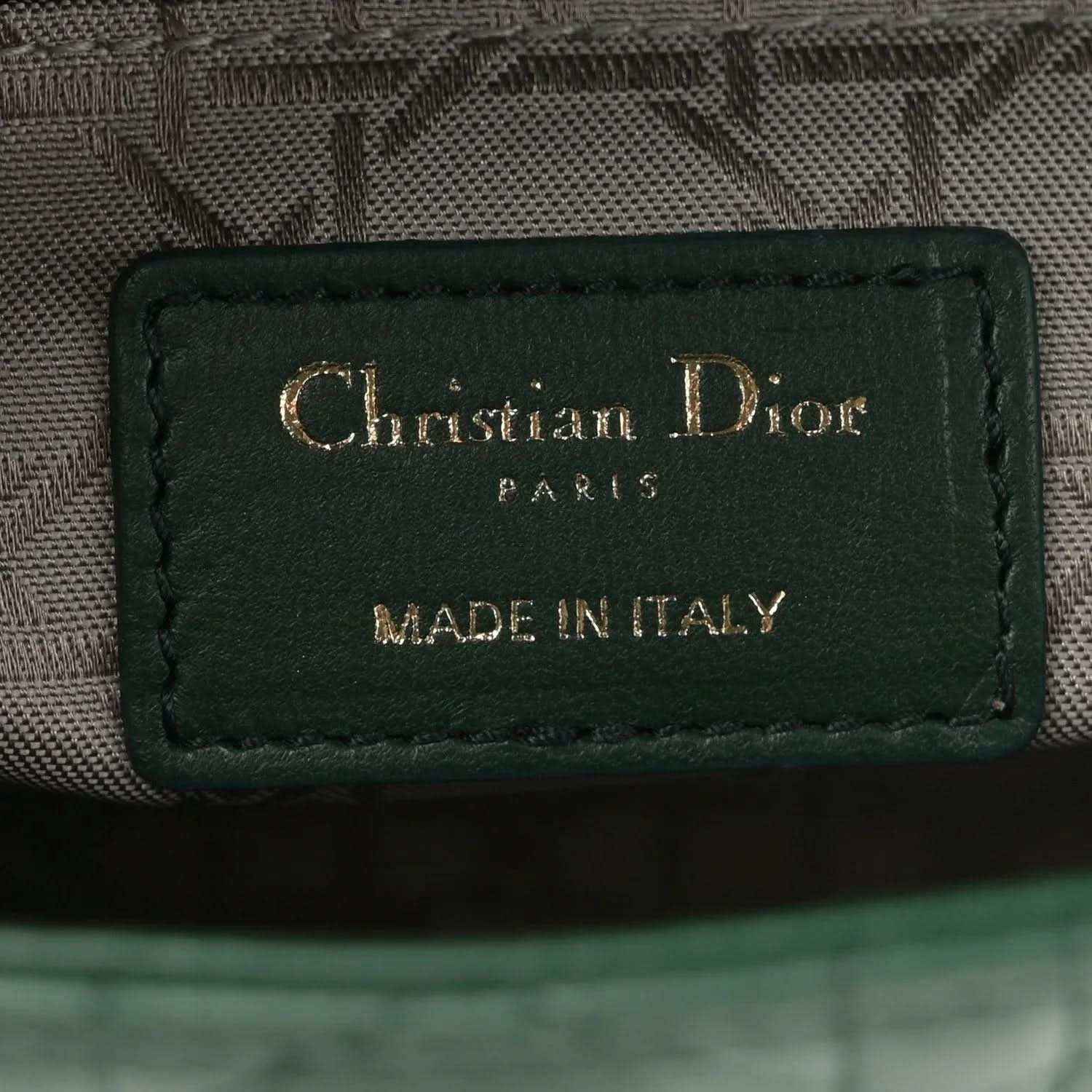 Green leather logo patch reading Christian Dior Paris, made in Italy