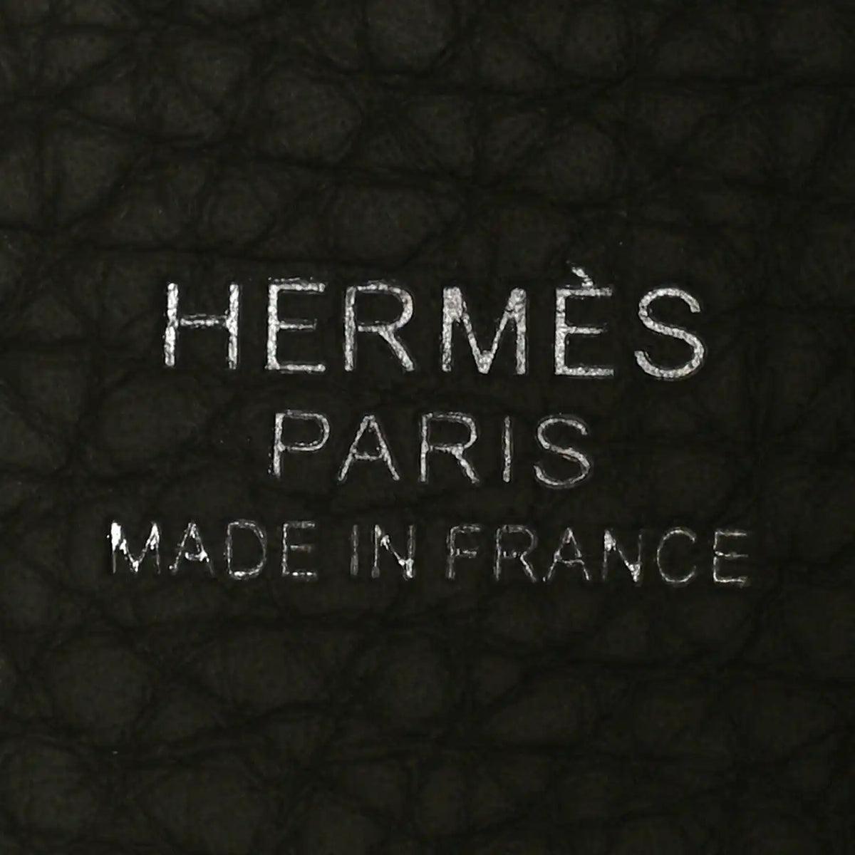 Leather bucket bag interior branding stamp: HERMES PARIS MADE IN FRANCE