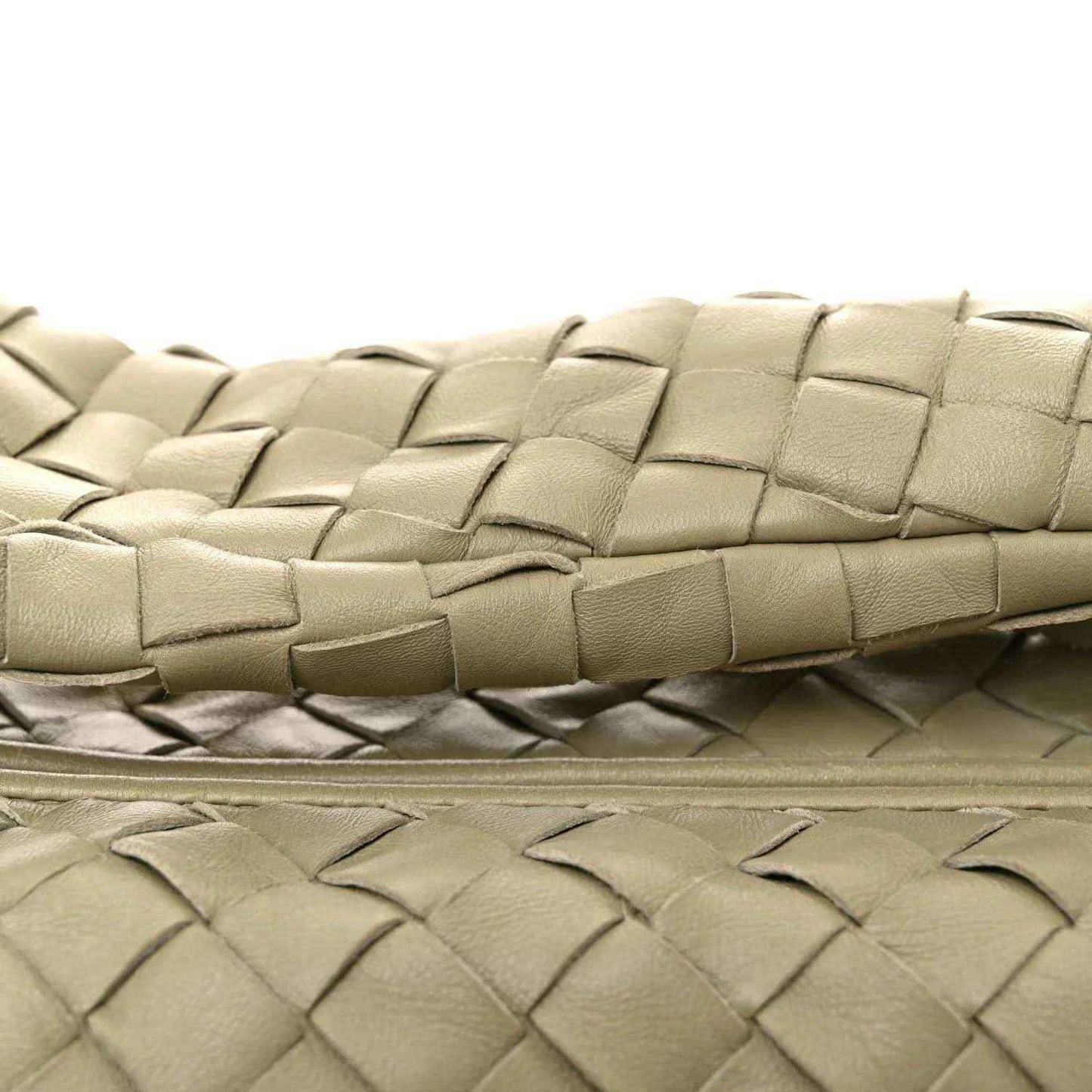 Small woven lambskin leather bag in light travertine tone, close-knit braided weave