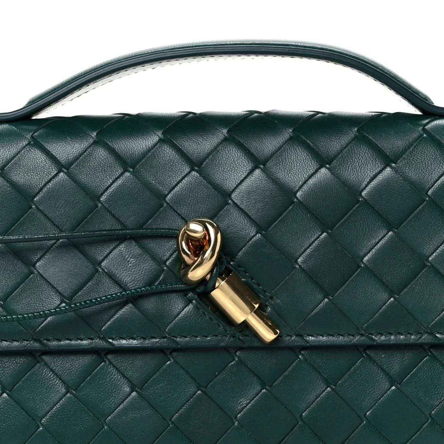 Emerald green intrecciato nappa clutch bag close-up with gold clasp detail