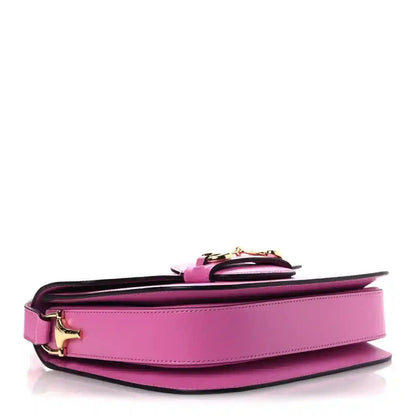 Gucci pink shoulder bag close view of base and underside hardware with flap