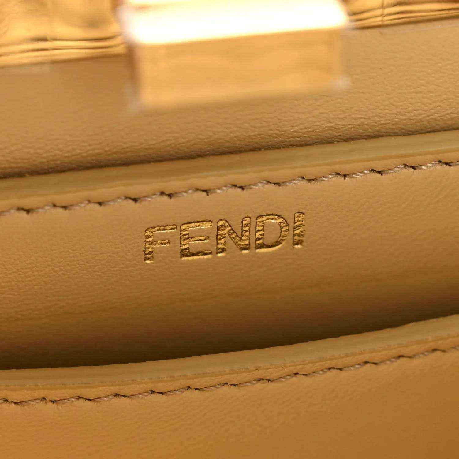 Petite satchel bag leather label with FENDI embossed and stitched edge detail.