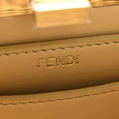 Petite satchel bag leather label with FENDI embossed and stitched edge detail.