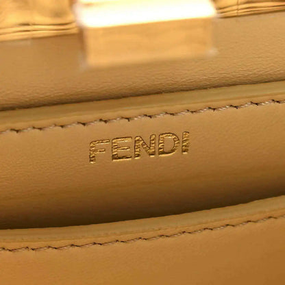 Petite satchel bag leather label with FENDI embossed and stitched edge detail.