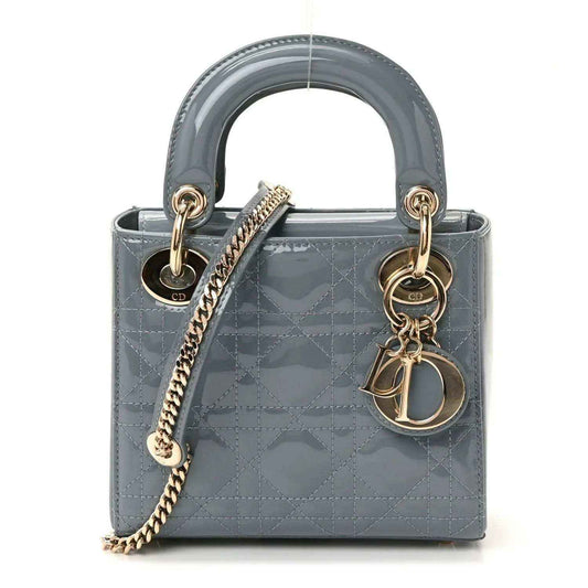 Light blue patent mini Lady Dior bag with top handles, chain strap, and Dior charm
