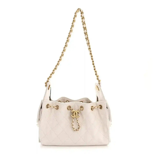 White quilted mini handbag with gold chain strap and CC-style front charm clasp