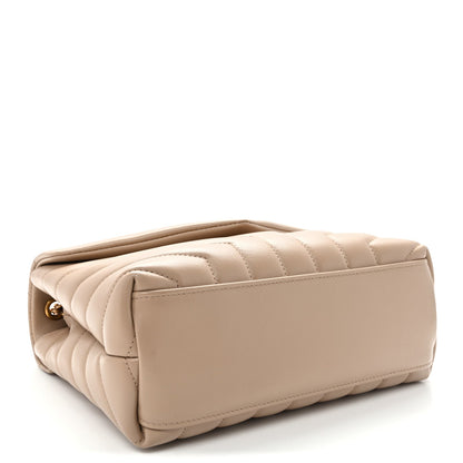 Quilted dark beige satchel side view with stitched panels and fold-over flap