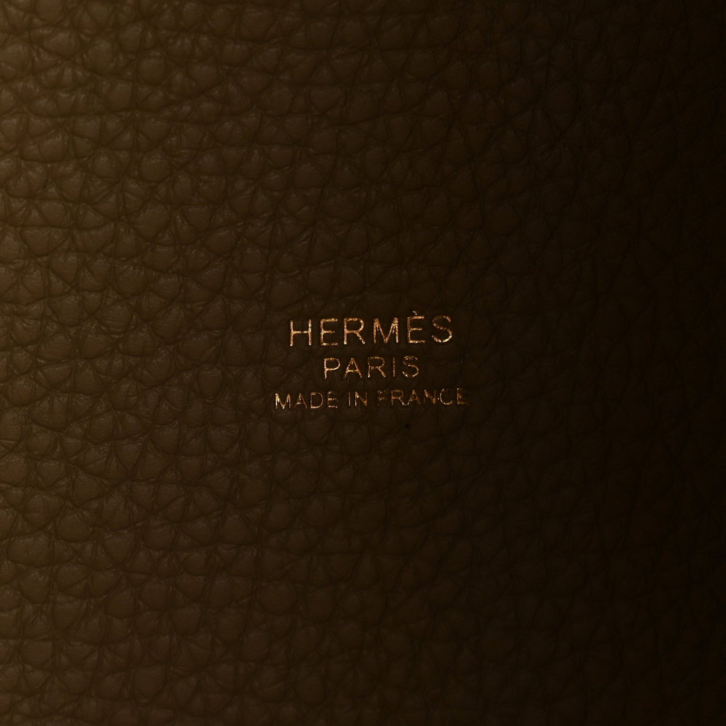 Beige leather tote interior with embossed HERMES PARIS and Made in France text