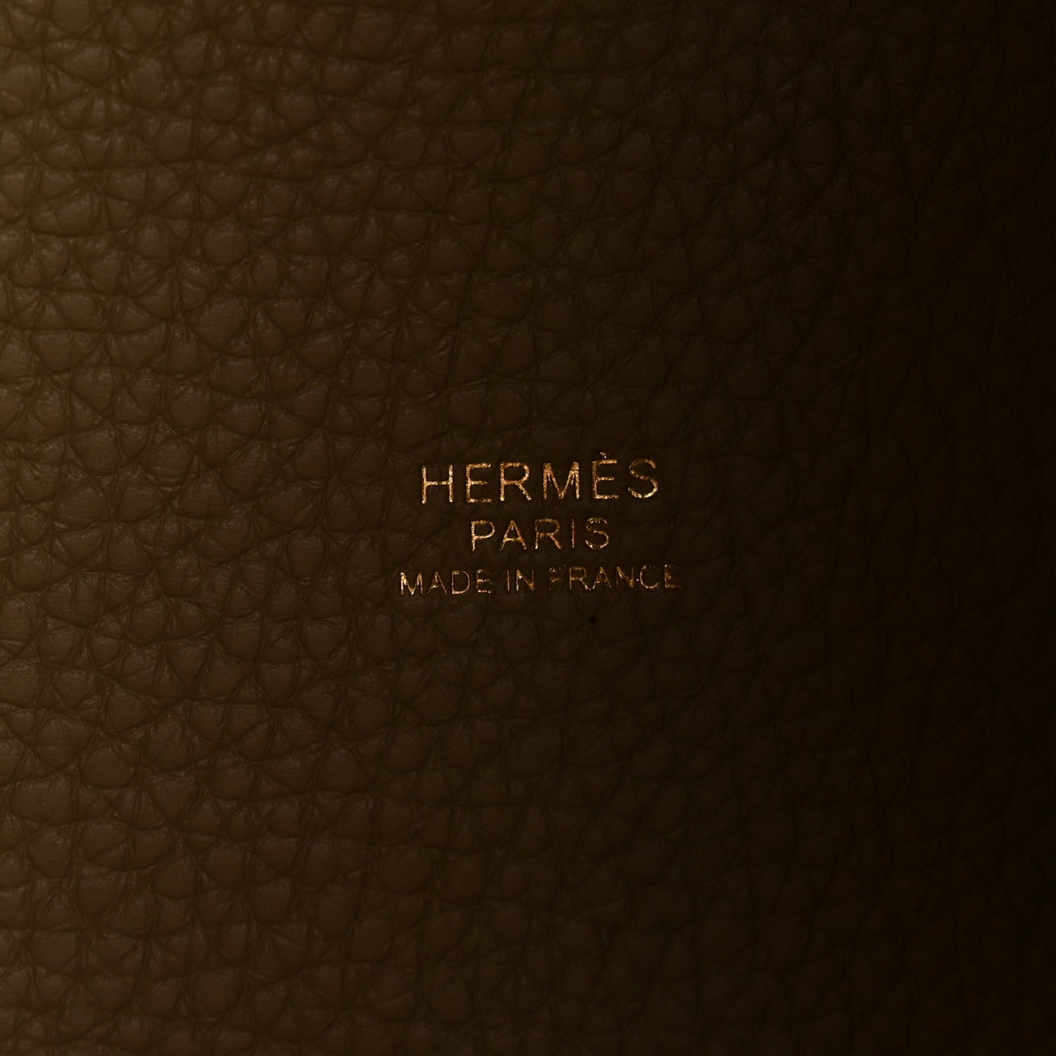 Beige leather tote interior with embossed HERMES PARIS and Made in France text